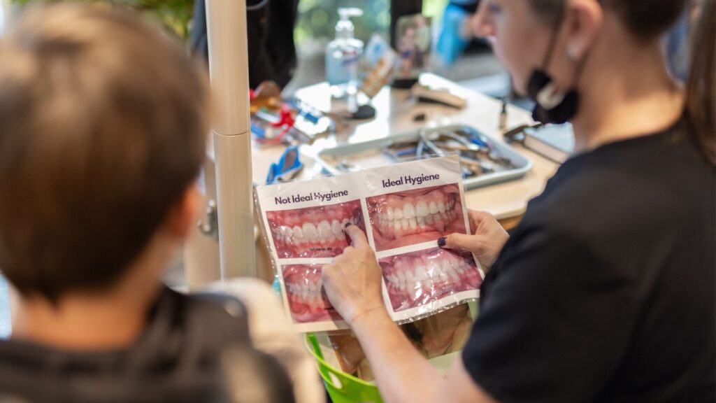 assistant teaches during Orthodontic Health Month