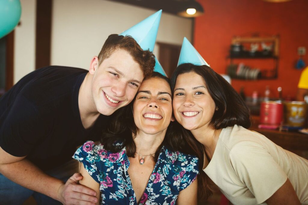 three friends smiling with perfect teeth